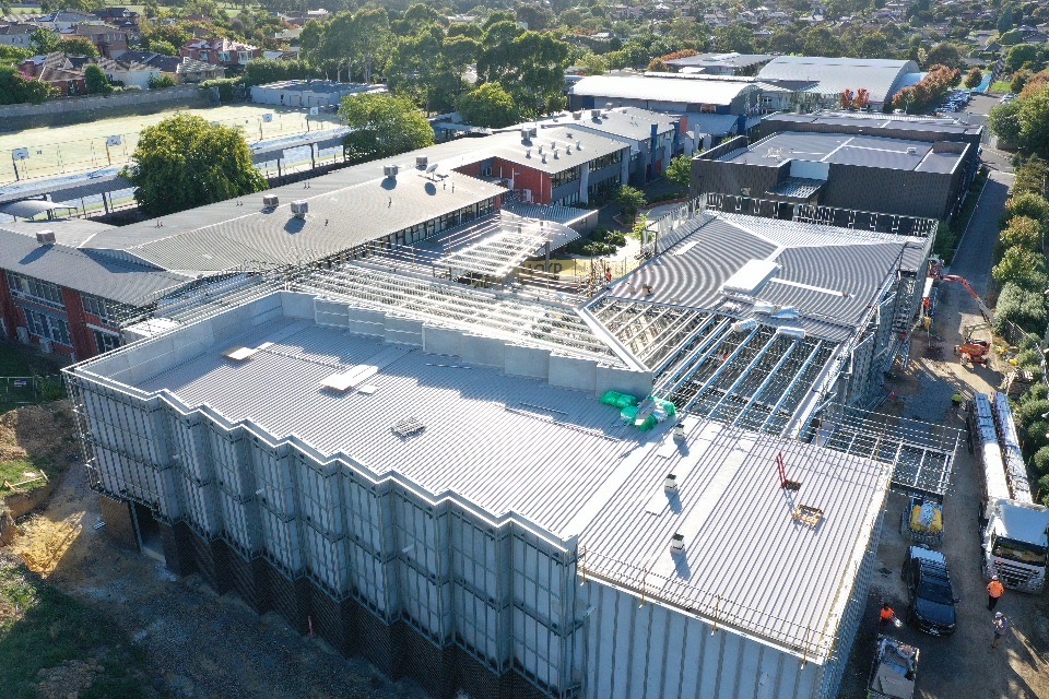Drone view of the Emmaus College standing-seam mansard