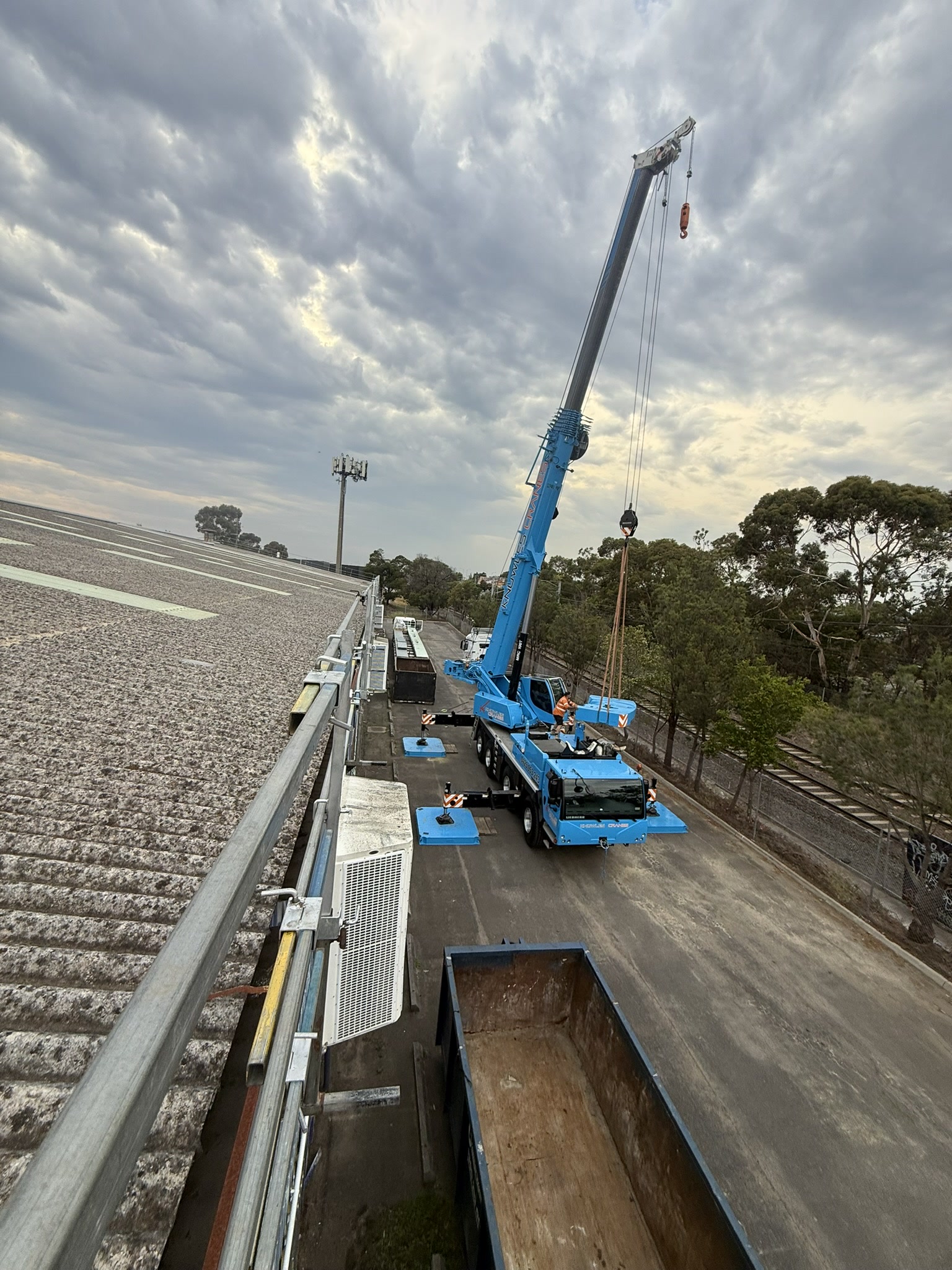 Crane lifting 25 metre sheets at Inflatable World Oakleigh