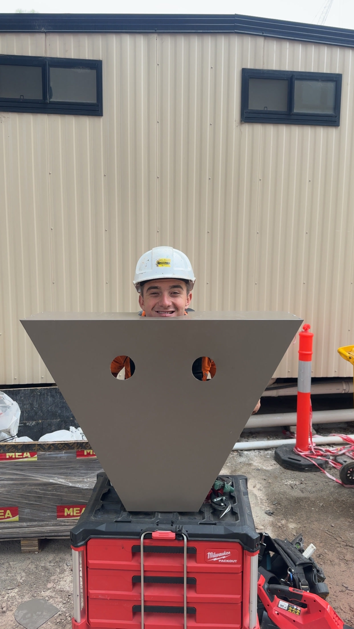 QP crew member with a custom-folded sumphead at Richmond Primary School